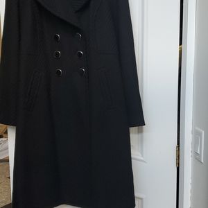 Full length black coat. Never worn without tags